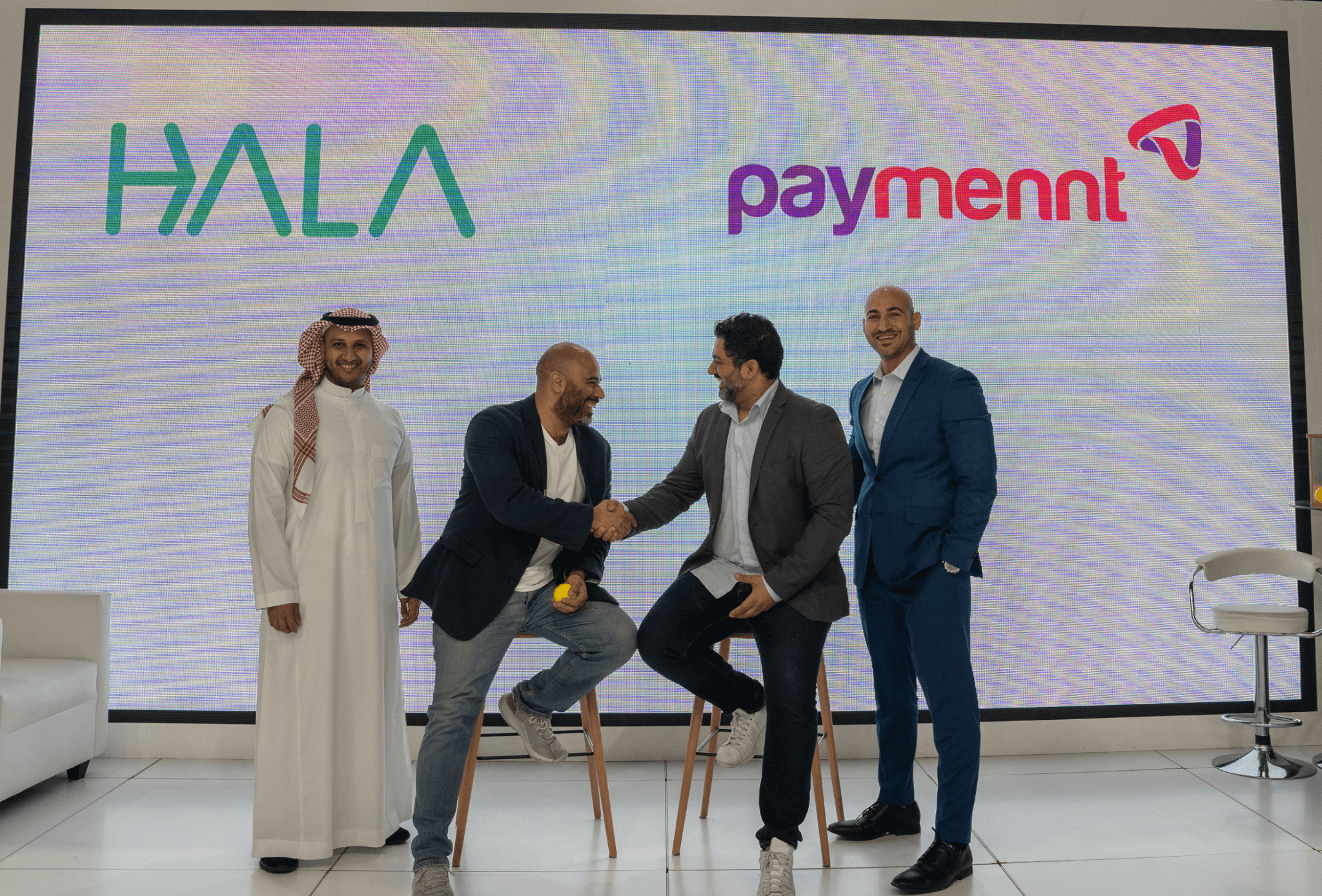 “Bashar Saleh, CEO of Paymennt, shaking hands with Maher Loubieh, Co-Founder of HALA.”