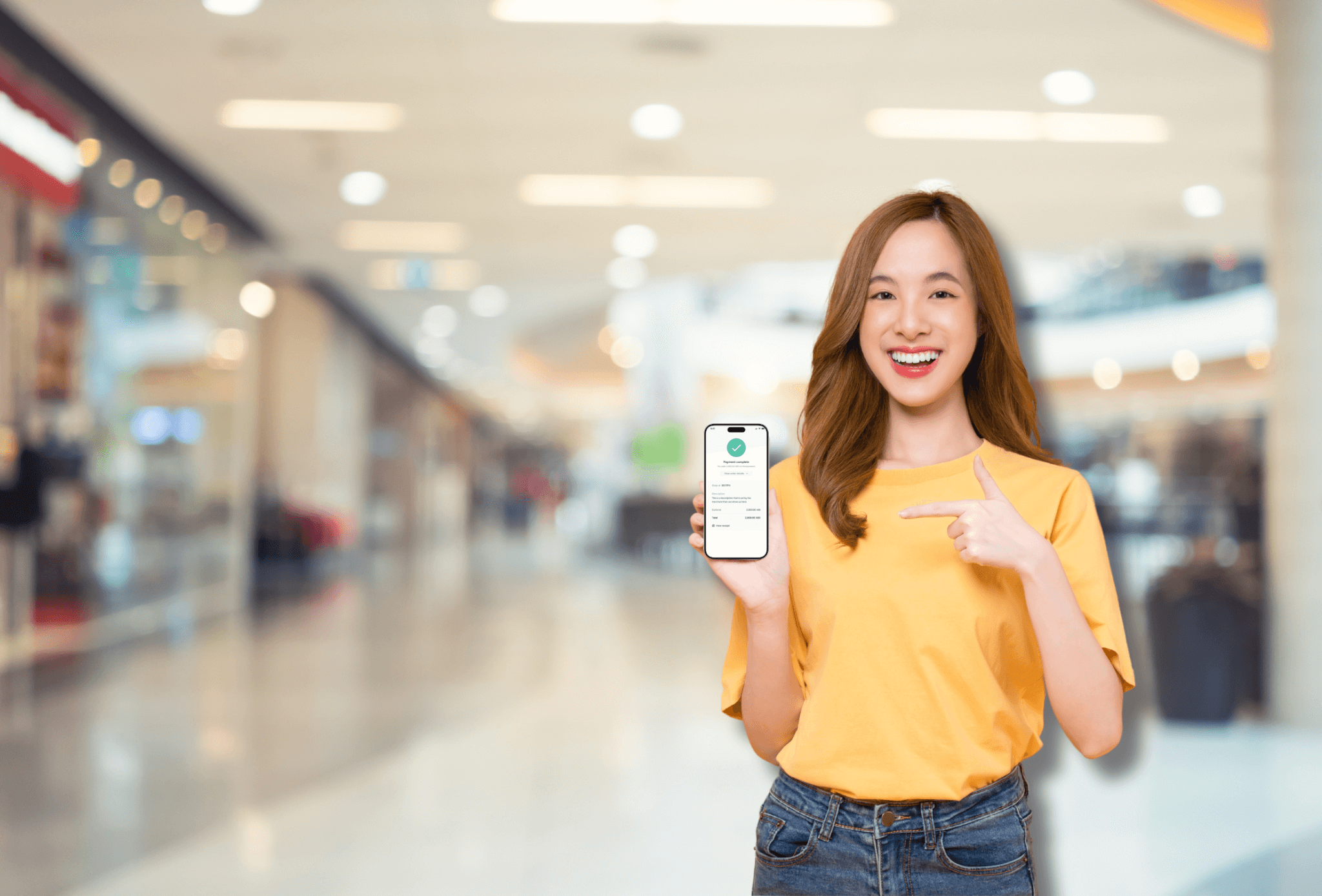 Lady holding phone showing payment link screen