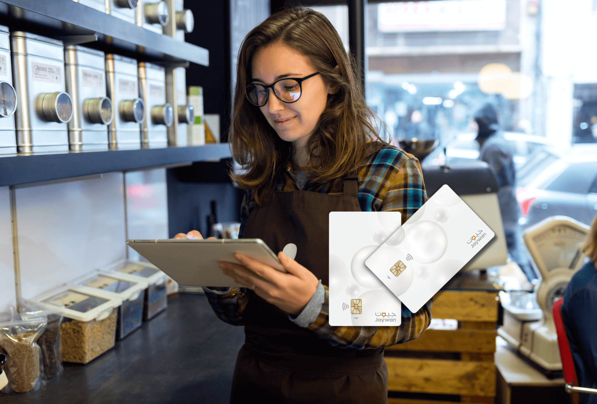 A merchant holding iPad and Jaywan Card