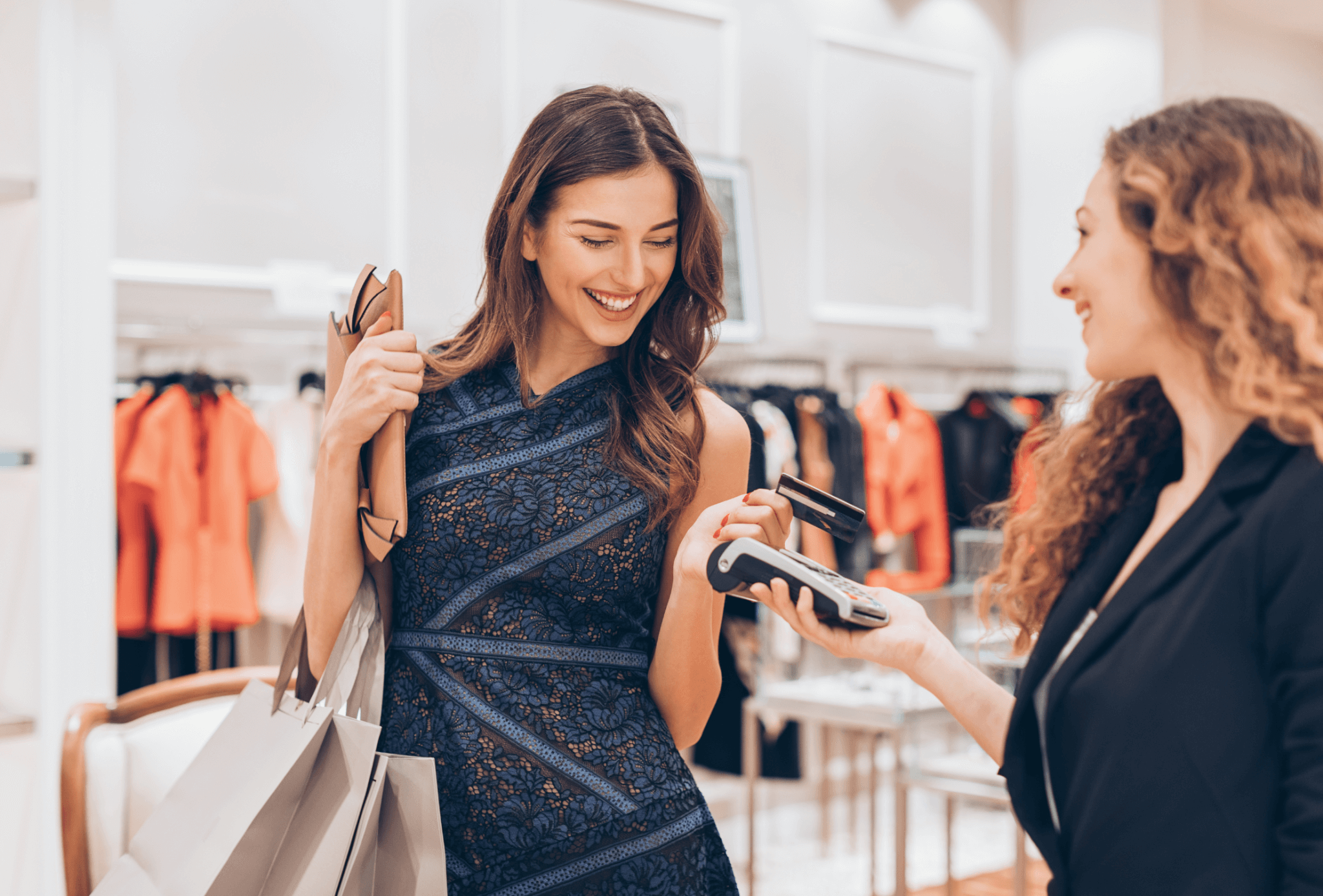 A lady paying using card in store